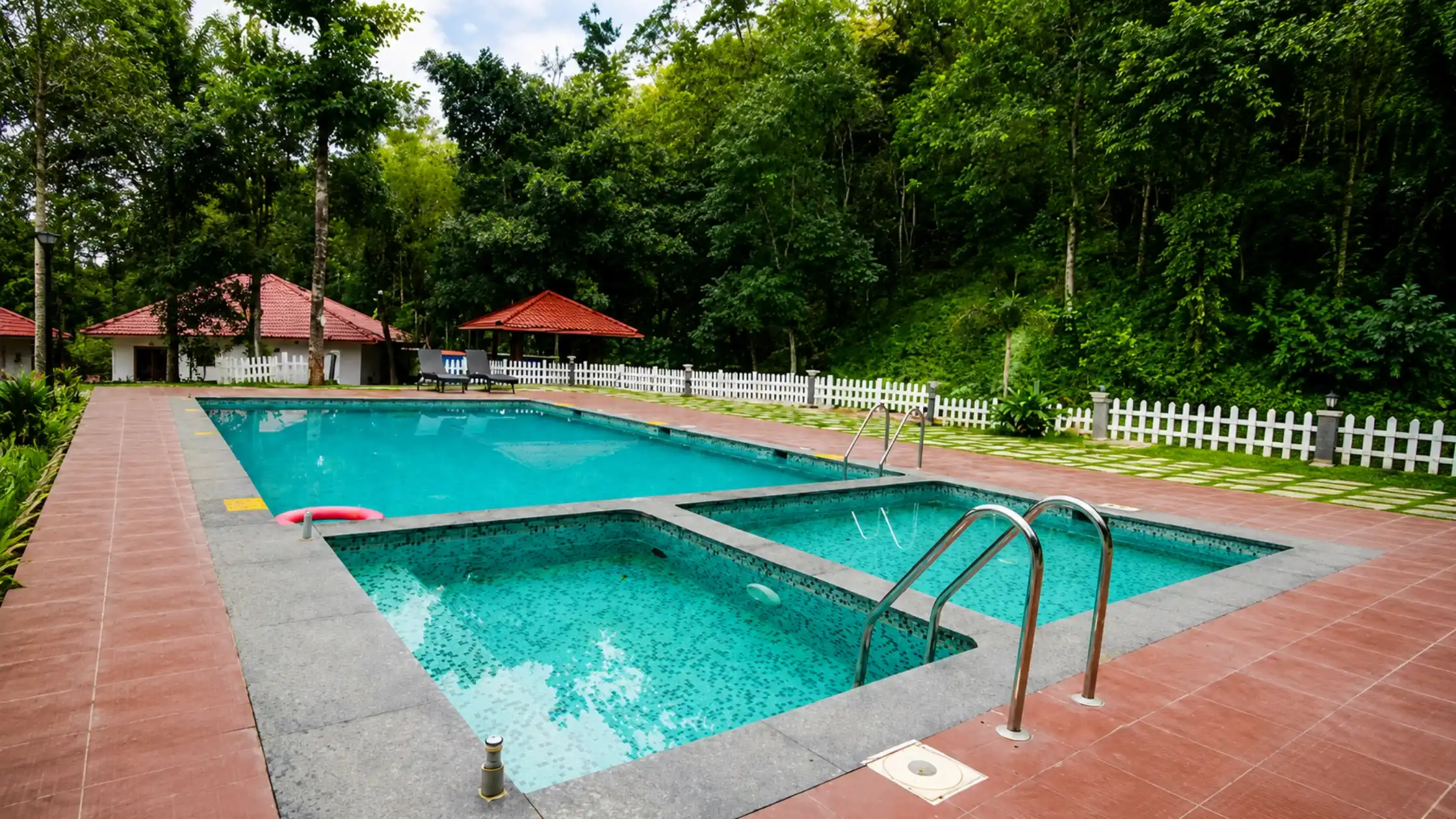 Swimming pool and outdoor amenities at a Sakleshpur resort